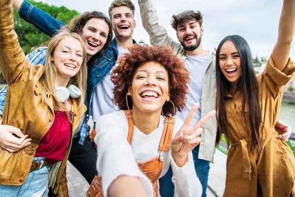 depositphotos_656997976-stock-photo-happy-different-young-people-having